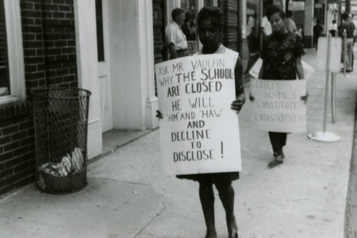 #8 Phyllis Hicks, second in line, carries “Closed Schools…” sign.
