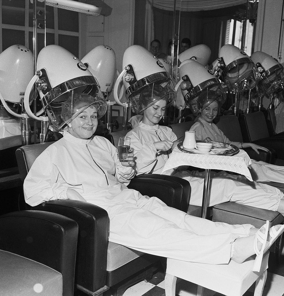 #28 Women Relaxing Under Hair Dryer
