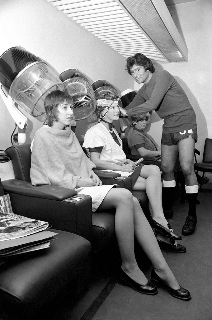 #4 Vidal Sassoon dressed in Chelsea’s Football strip seen in the women’s hairdressing salon attending to some clients, 1972