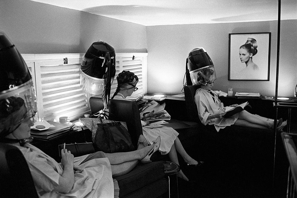 #31 At the hairdresser’s, some British women reading magazines under the hair dryer, London, 1960s.