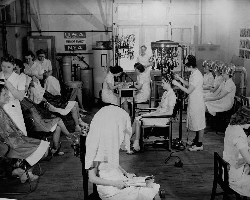 #67 Young women in the National Youth Administration work in a beauty shop to learn beautician skills at Camp Roosevelt in Ocala.