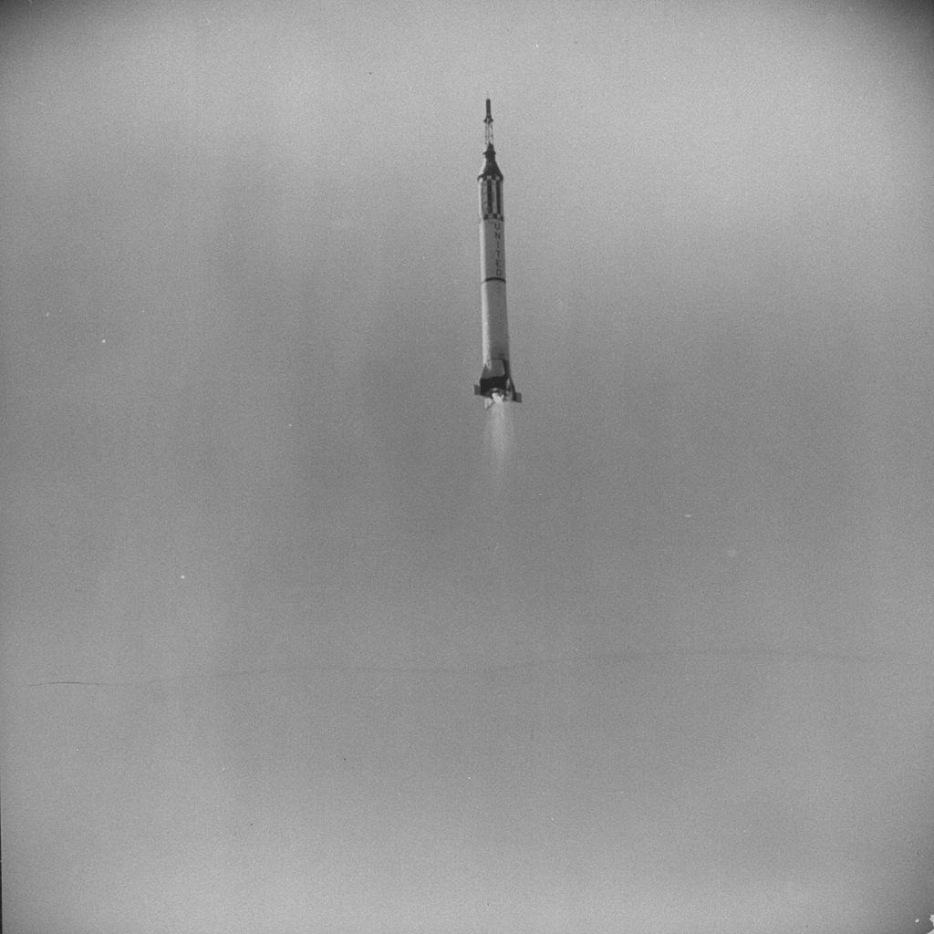 #12 Mercury space capsule, carrying chimp Ham, rocketing toward space.
