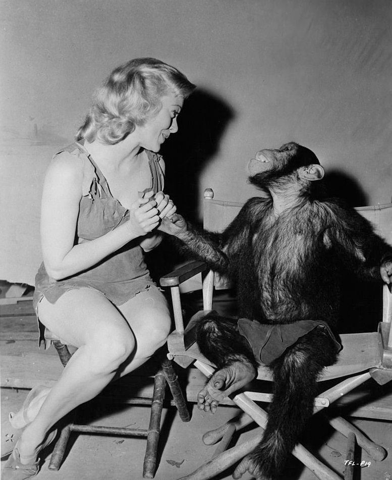 #20 Eve Brent and Cheta the chimpanzee ham it up in between scenes of the film ‘Tarzan’s Fight For Life’, 1958.
