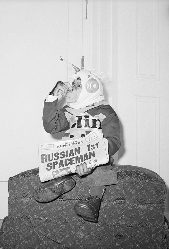 #5 Dressed han Holds Nose and Newspaper.