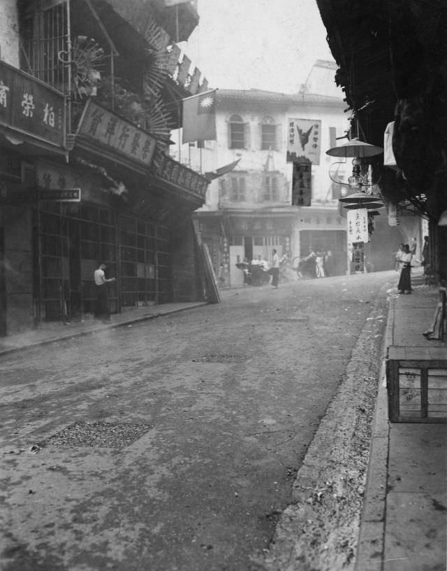 #12 Kowloon Street setting off firecrackers in celebration, August 31, 1945
