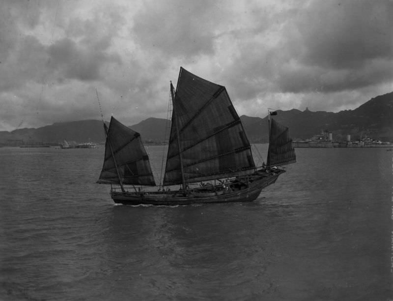 #7 Chinese sampan, H.M.C.S. Ontario in background, Hong Kong, August 31, 1945