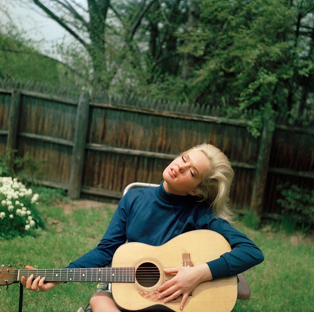 #11 17-years-old, Joey Heatherton playing guitar in her backyard, Rockville Centre, Long Island, New York