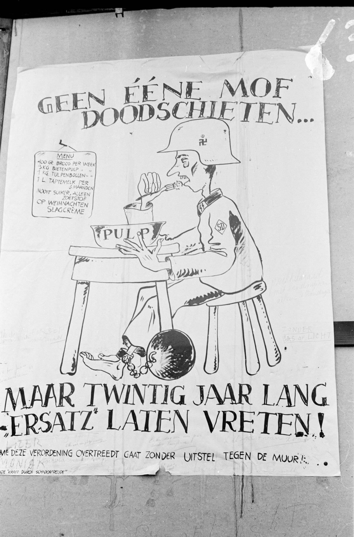 #26 Photo from the Huizinga collection of the NIOD. Cartoon posted on the Buitenhof, against the former German occupier because of hunger during the occupation.