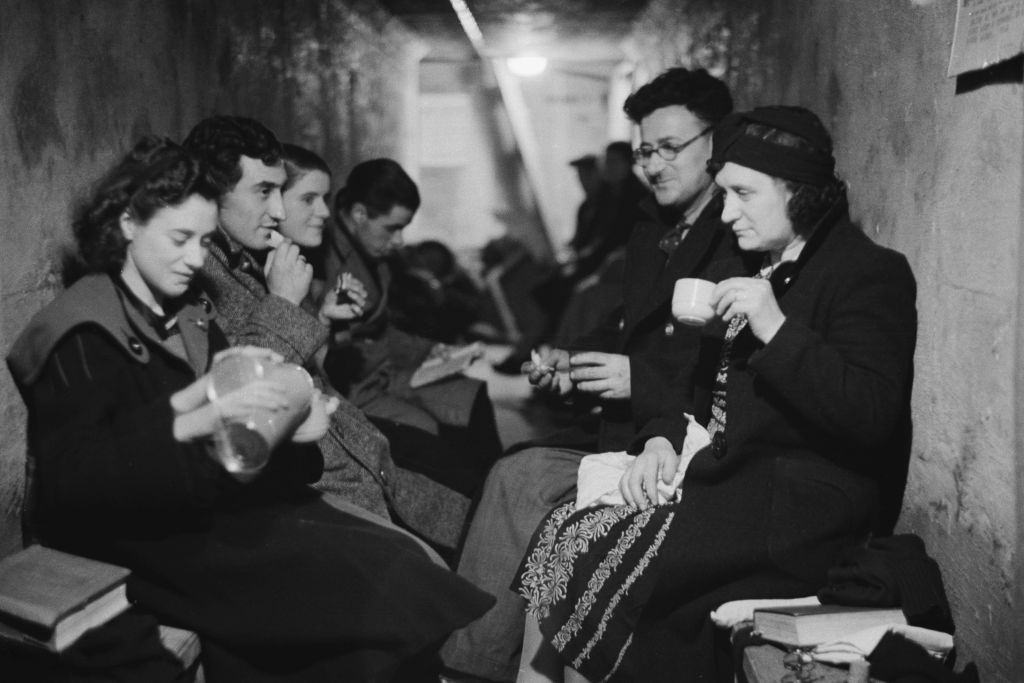 #28 A group of people in an air raid shelter during the Blitz, London, October 1940.