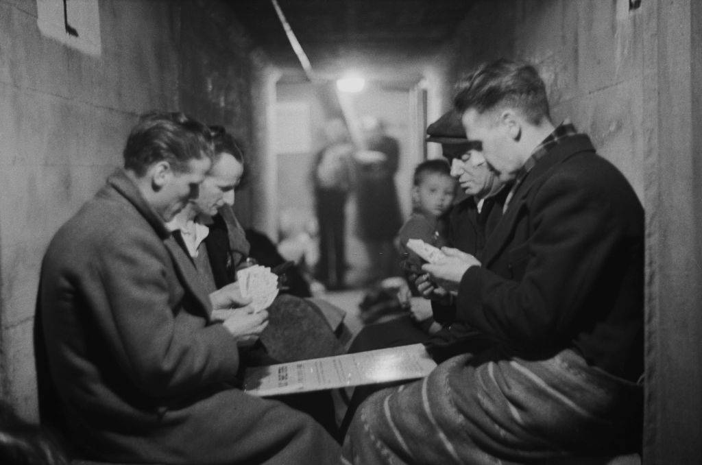 #29 A group of men playing cards in an air raid shelter during the Blitz, London, October 1940.