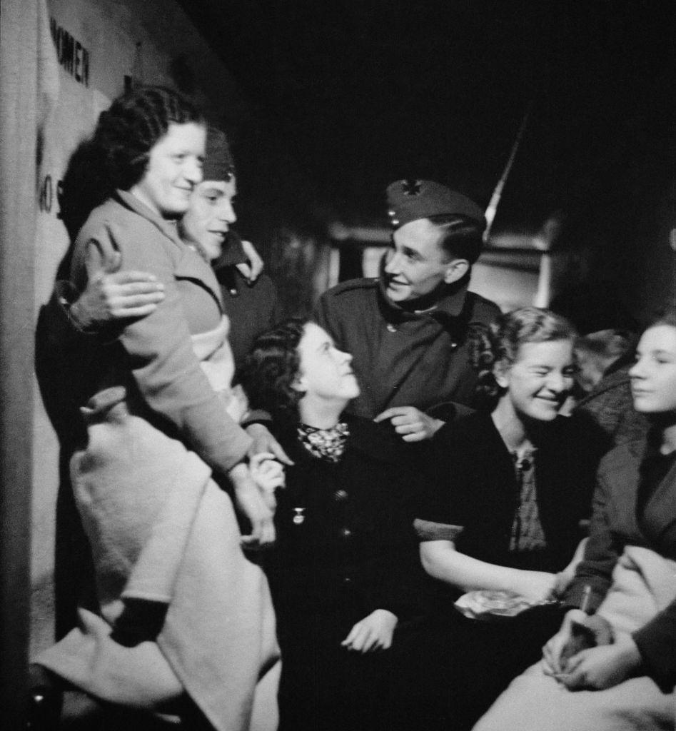 #38 A group of people in an air raid shelter during the Blitz, London, October 1940.