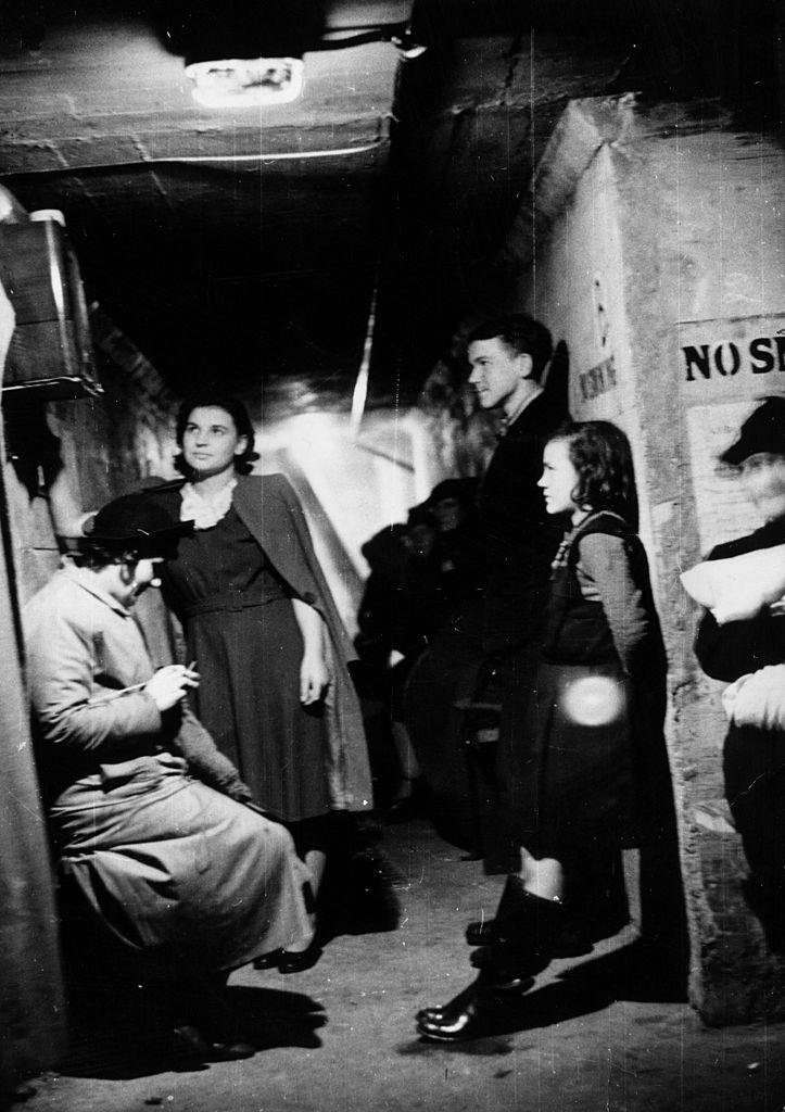 #47 A group of people in an air raid shelter during the Blitz, London, October 1940.