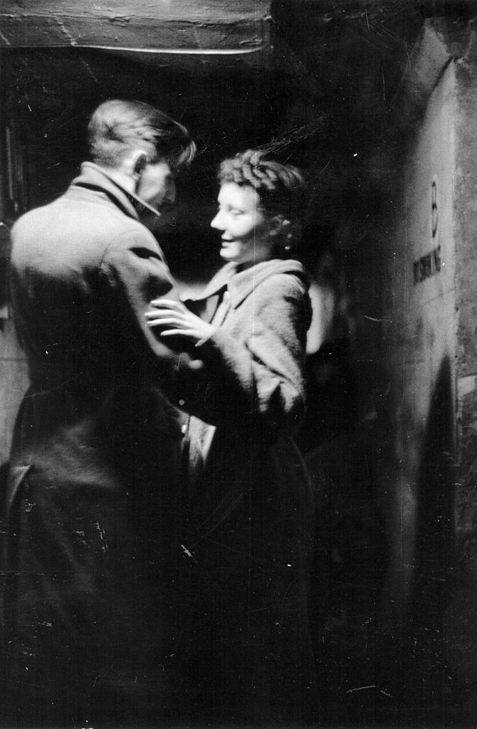 #50 A couple in an air raid shelter during the Blitz, London, October 1940.