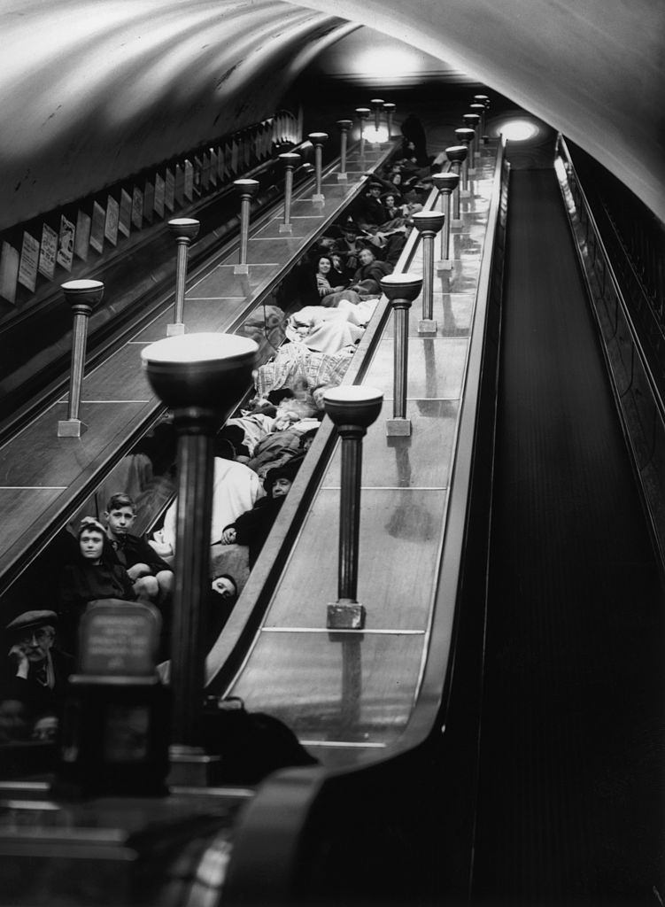 #57 Londoners shelter from air raids in an underground station during World War II, 1940.