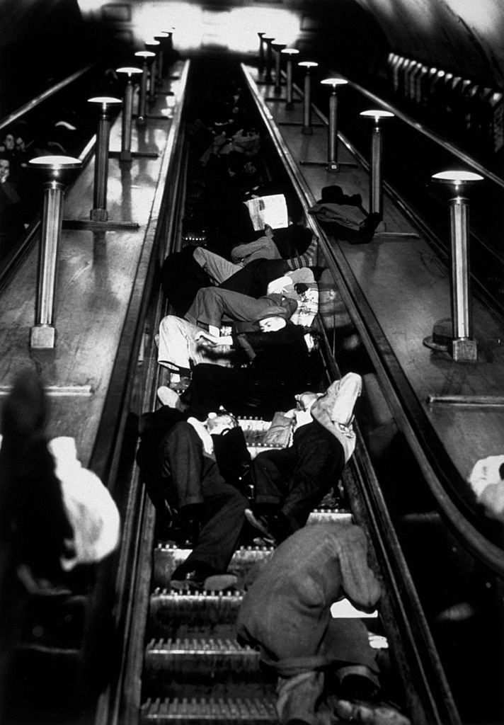 #59 People asleep on the escalators at Piccadilly Tube Station, London, during an air raid.