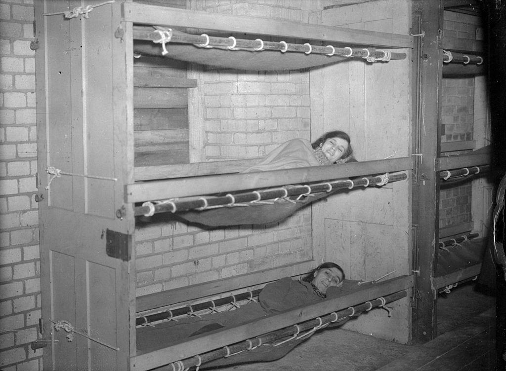 #2 Old doors are used as bed-heads, steel tubing is the framework and canvas the matress for bunk beds in a London shelter during WW II.