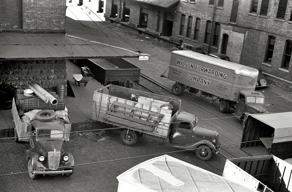 #25 Trucks loading at farm implement warehouse, Minneapolis, Minnesota, September 1939