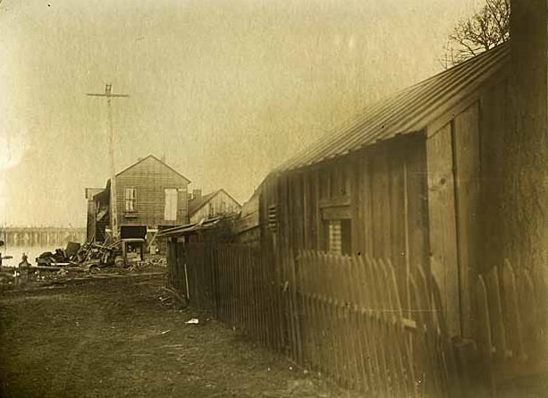#13 A building and a shed, identified as the rear of the Washington Standard building, in Olympia, 1890s