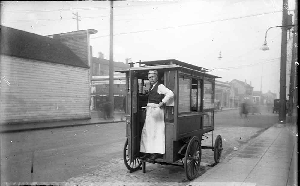 #42 A street food vendor at 4th and Washington, Olympia, 1910s