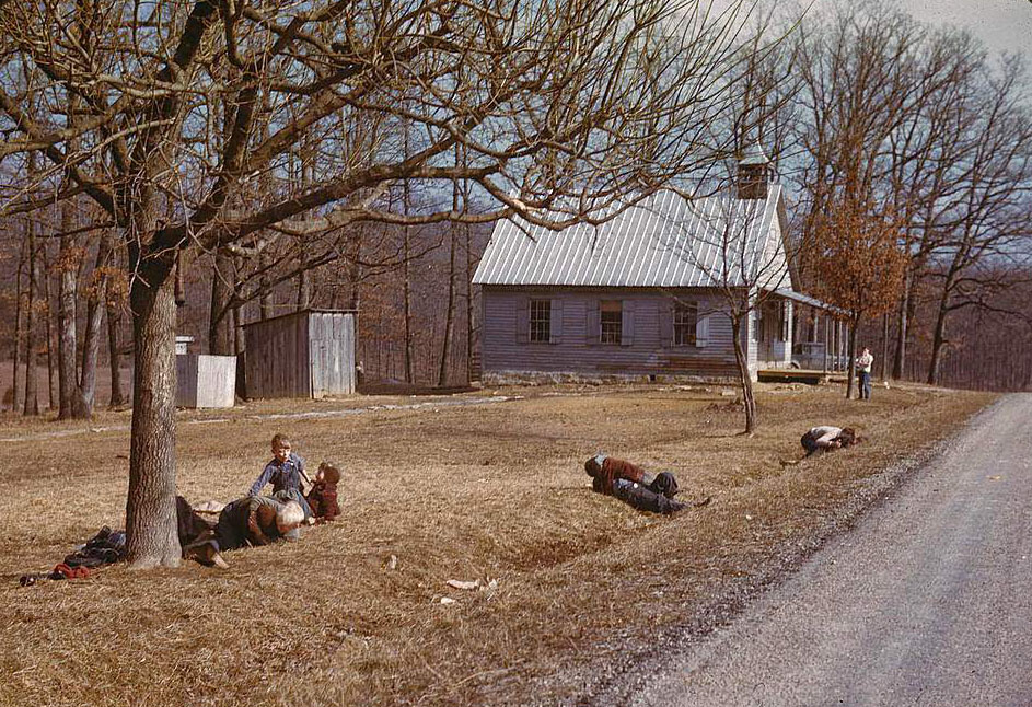 #104 Children playing by road near school house, Kansas, 1950s