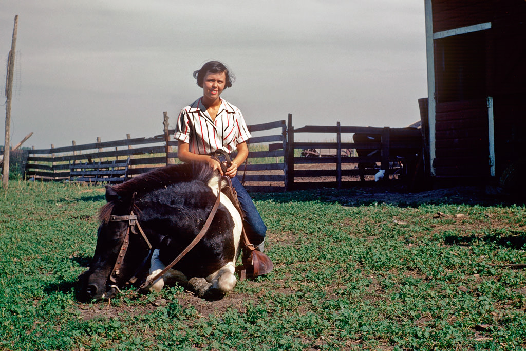 #54 Girl riding on horseback, South Dakota, 1950