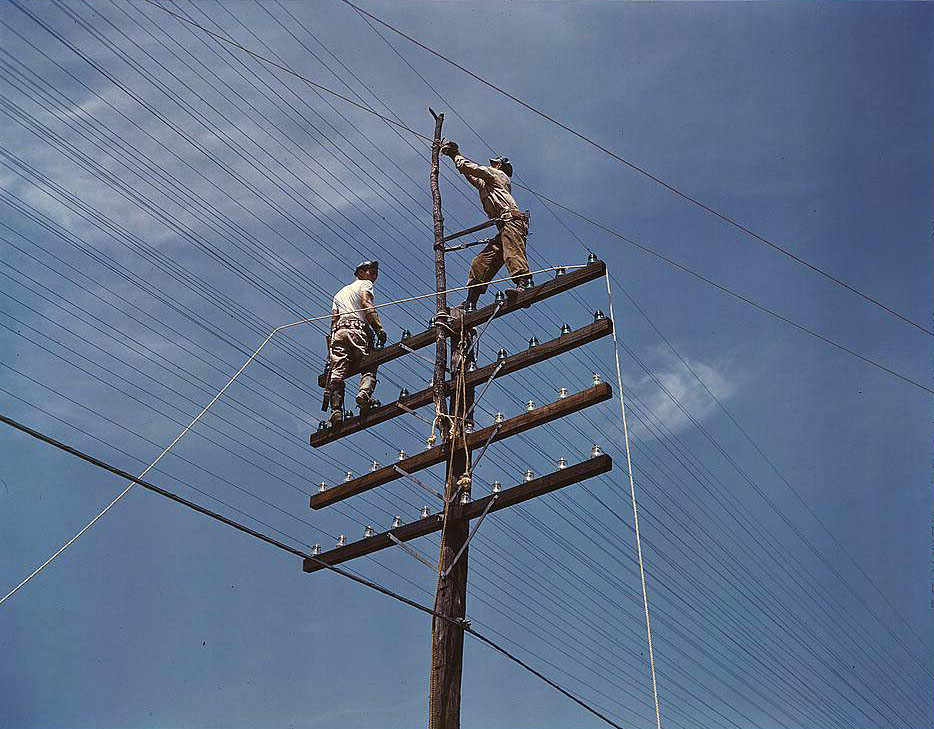 #87 Men working on telephone lines, probably near a TVA dam hydroelectric plant, 1950s