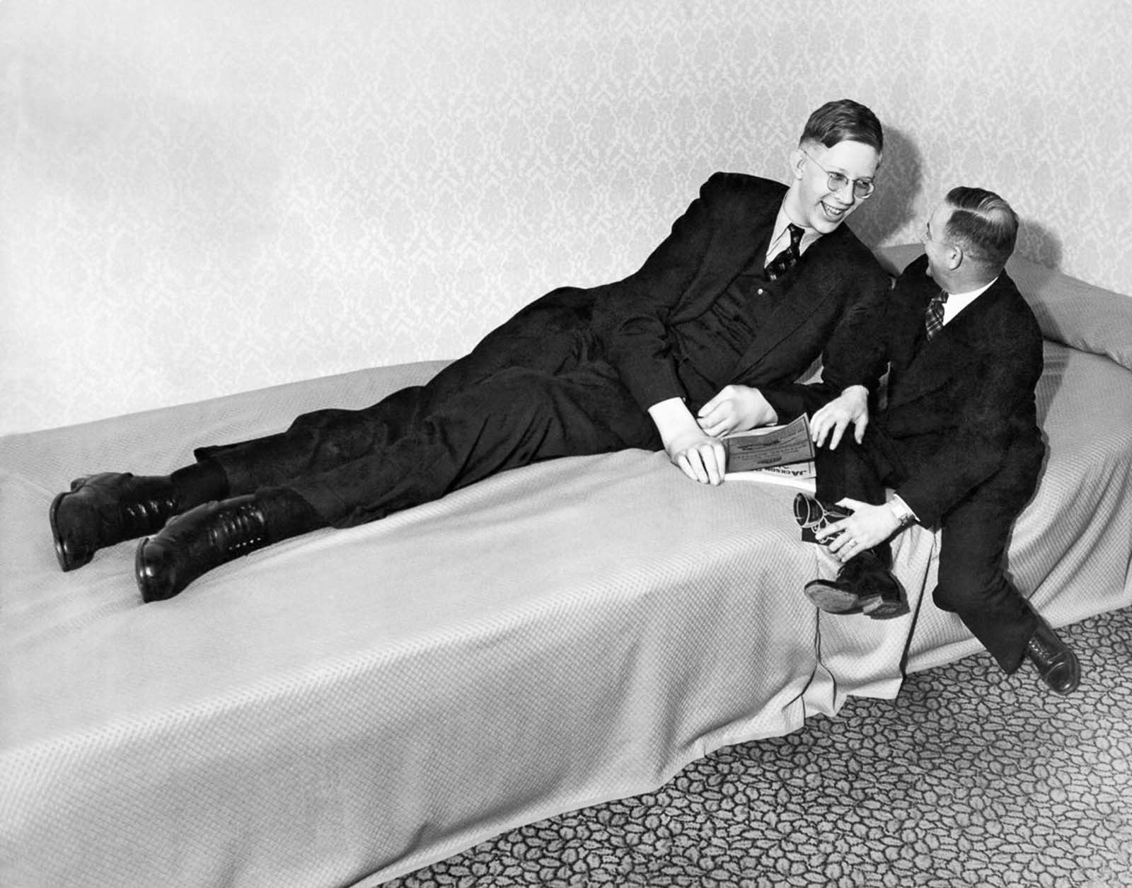 #26 Wadlow chats with a friend after appearing at a charity event in Omaha, Nebraska, 1937.