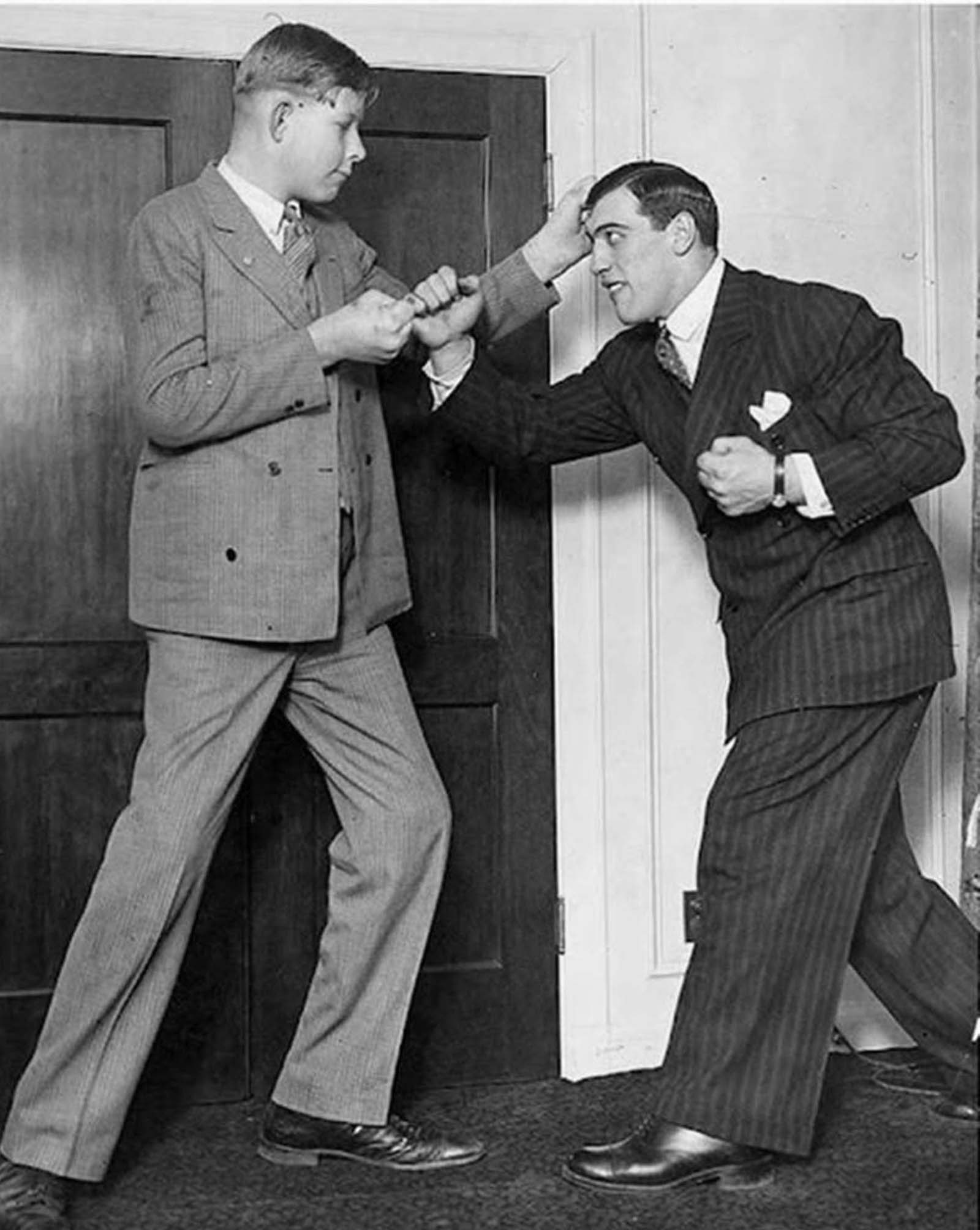 #33 A 12-year-old Robert Wadlow with boxing legend, Primo Carnera. Primo was 6’9″ and Robert was 7’2″.
