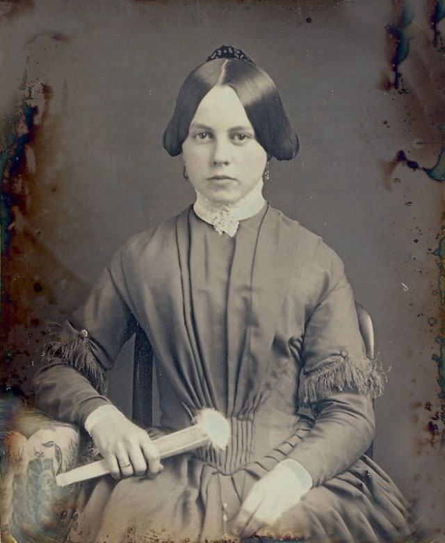 #11 A pretty girl holding her fan