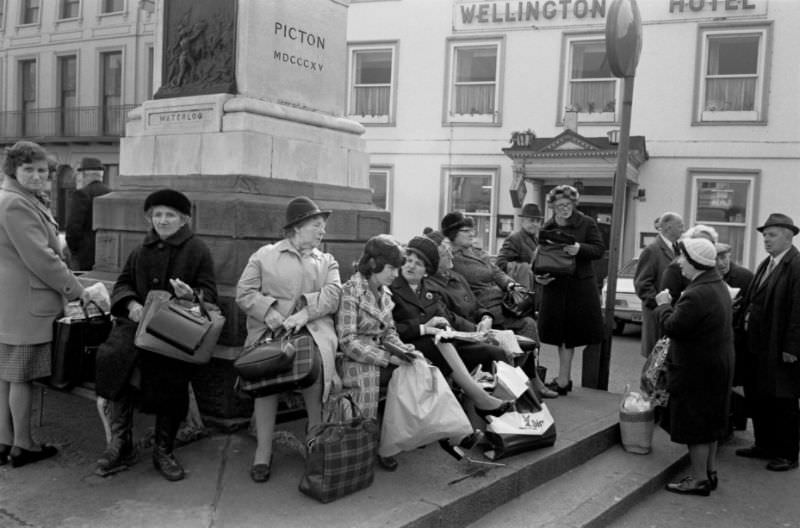 #12 Waiting for a bus beneath the Duke of Wellington monument in Brecon