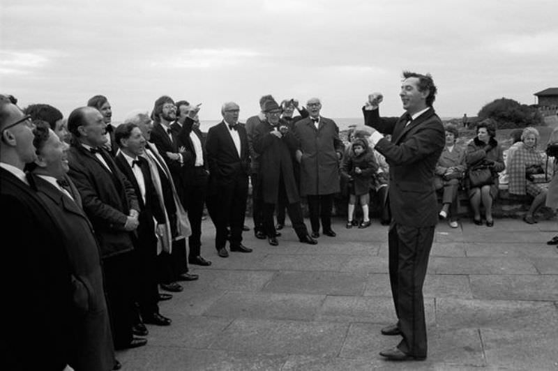 #36 A male voice choir practising on the seafront at Porthcawl during the Miners’ Eisteddfod