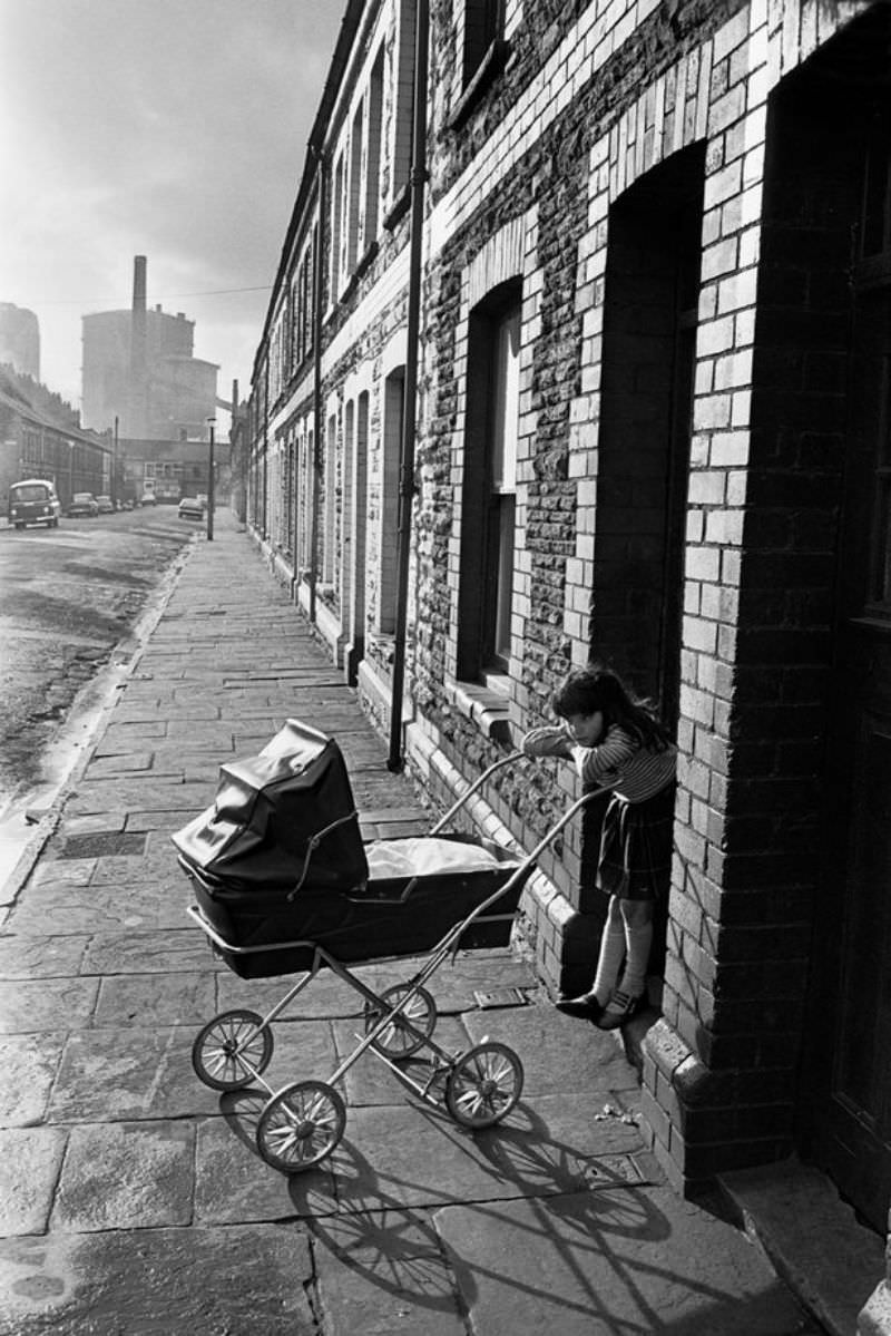 #38 A girl plays with a baby in Splott, Cardiff