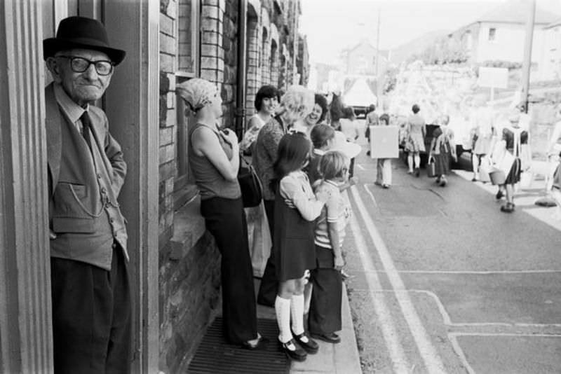 #54 People watch the carnival procession pass in Abertillery