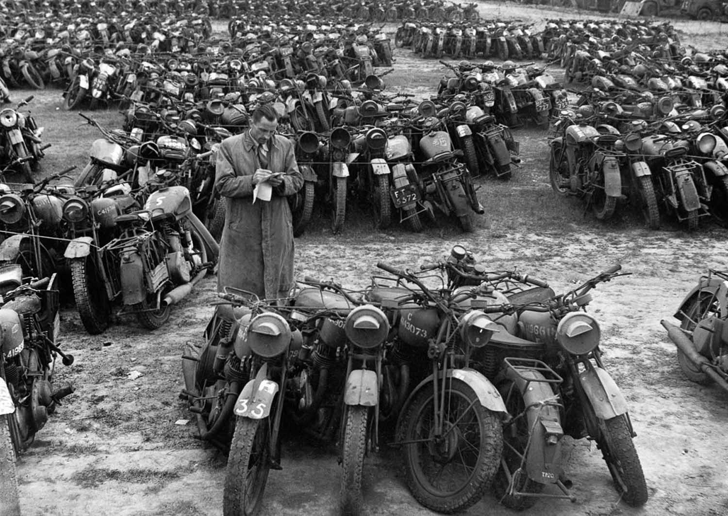 #6 Surplus motorcycles in England are bundled in groups of five to be sold as scrap.