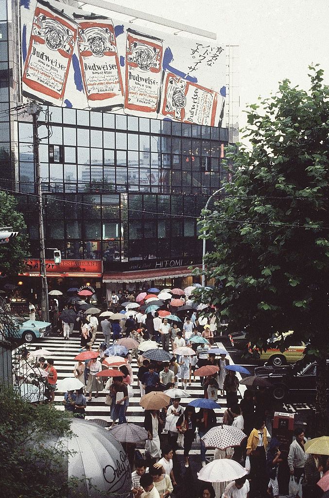 #100 Billboards and Pedestrians with Umbrellas on Tokyo Street, 1980s