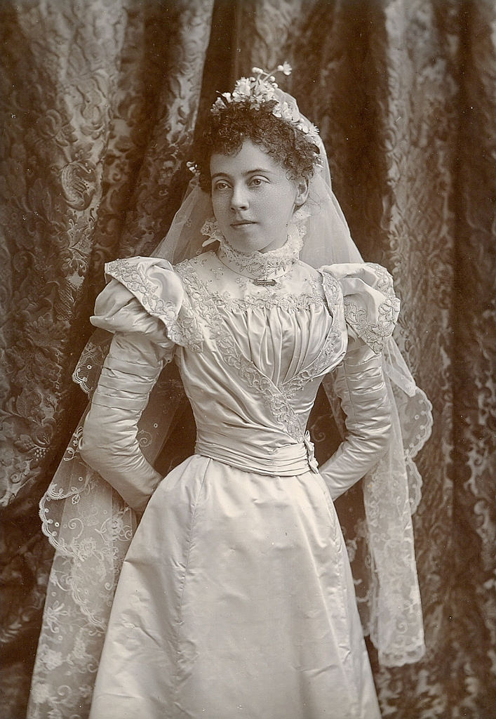 #15 Young lady poses in her wedding dress, 1885