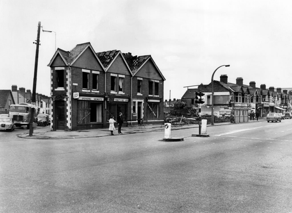 #103 The demolition men are changing the face of the Gabalfa, Cardiff, junction of Western Avenue, North Road and Whitchurch Road. These shops and houses on the corner of Whitchurch Road are the latest to come down to make way for a roundabout which will be in use while work continues on the Eastern by-pass, 20th August 1968.