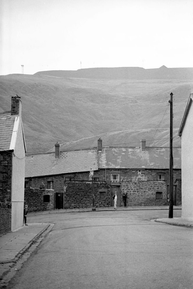 #43 Children stand on the street in the mining town of Tonypandy, Wales, United Kingdom, 1966.