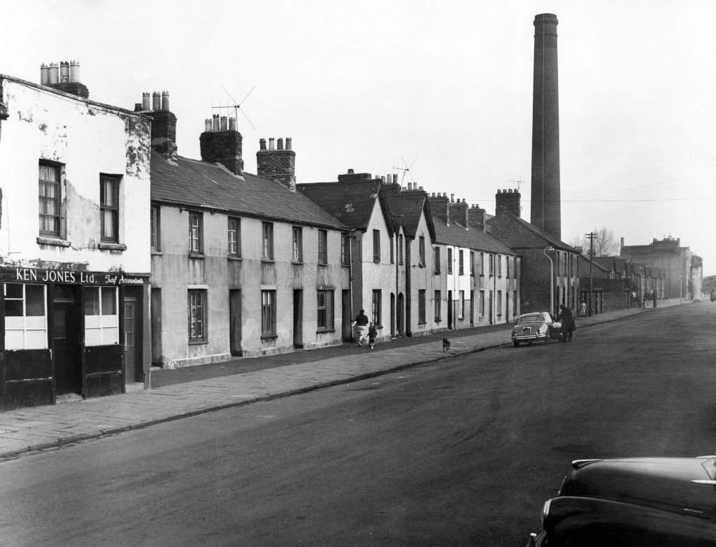 #51 Newtown was a residential area of Cardiff, Wales that existed from the mid-nineteenth century until it was demolished in 1970. Pictured, a street scene, December 1964.