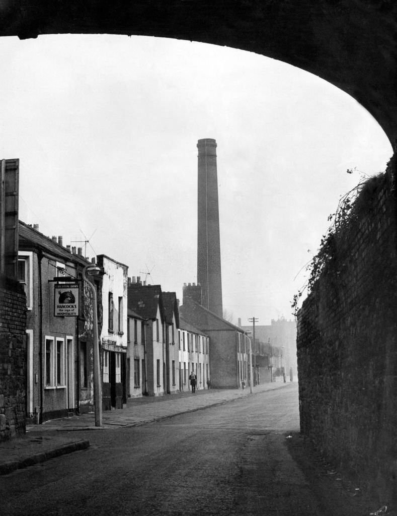 #61 Newtown was a residential area of Cardiff, Wales that existed from the mid-nineteenth century until it was demolished in 1970. Pictured, Tyndall Street, 1964.