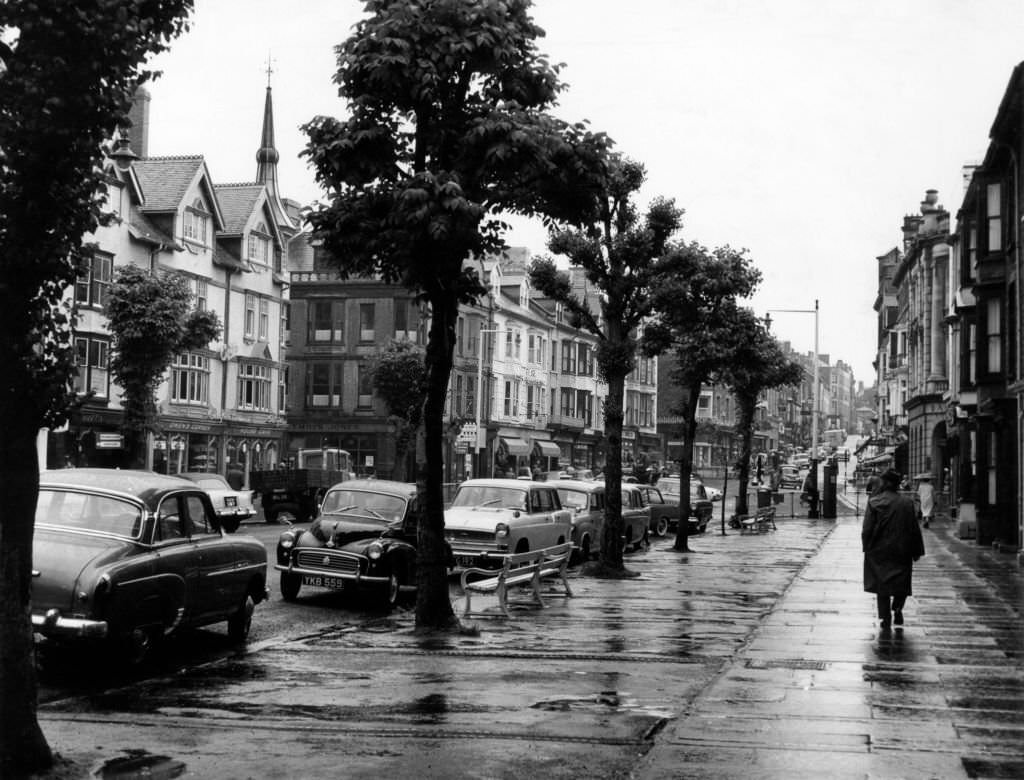 #76 Street Scenes, Aberystwyth, Ceredigion, West Wales, 22nd June 1961. Tree lined main street with its ample parking spaces.