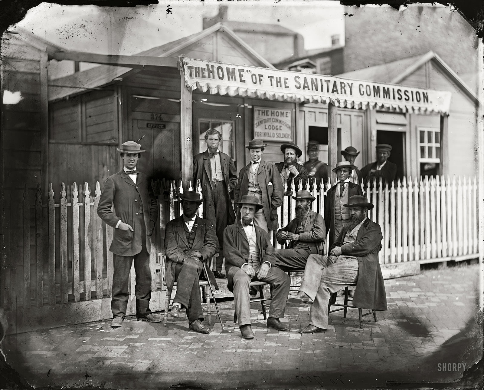 #22 Washington, D.C. Sanitary Commission workers at the entrance of the Home Lodge for Invalid Soldiers, Washington, D.C., 1863.