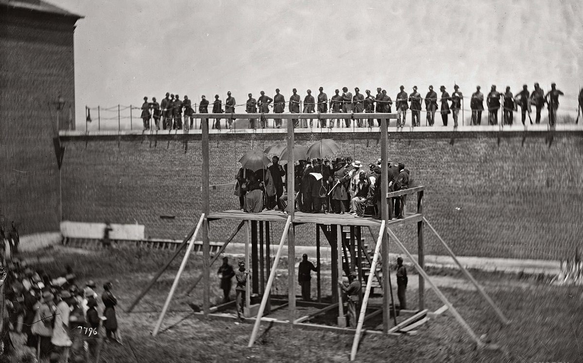 #13 Gen. John F. Hartranft reading the death warrant to the four condemned Lincoln assassination conspirators, July 7, 1865