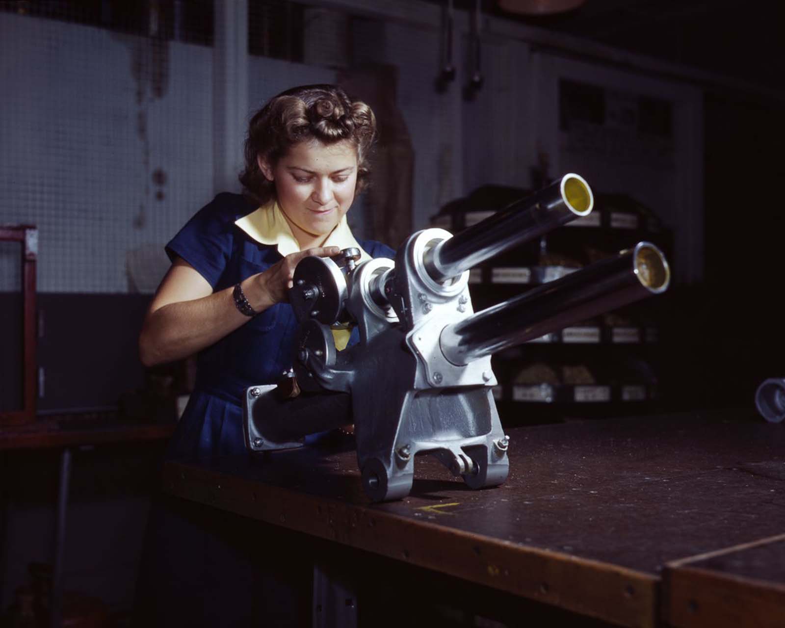 #18 A North American Aviation employee works on the landing gear mechanism of a P-51 fighter at the plant in Inglewood, California, 1942.
