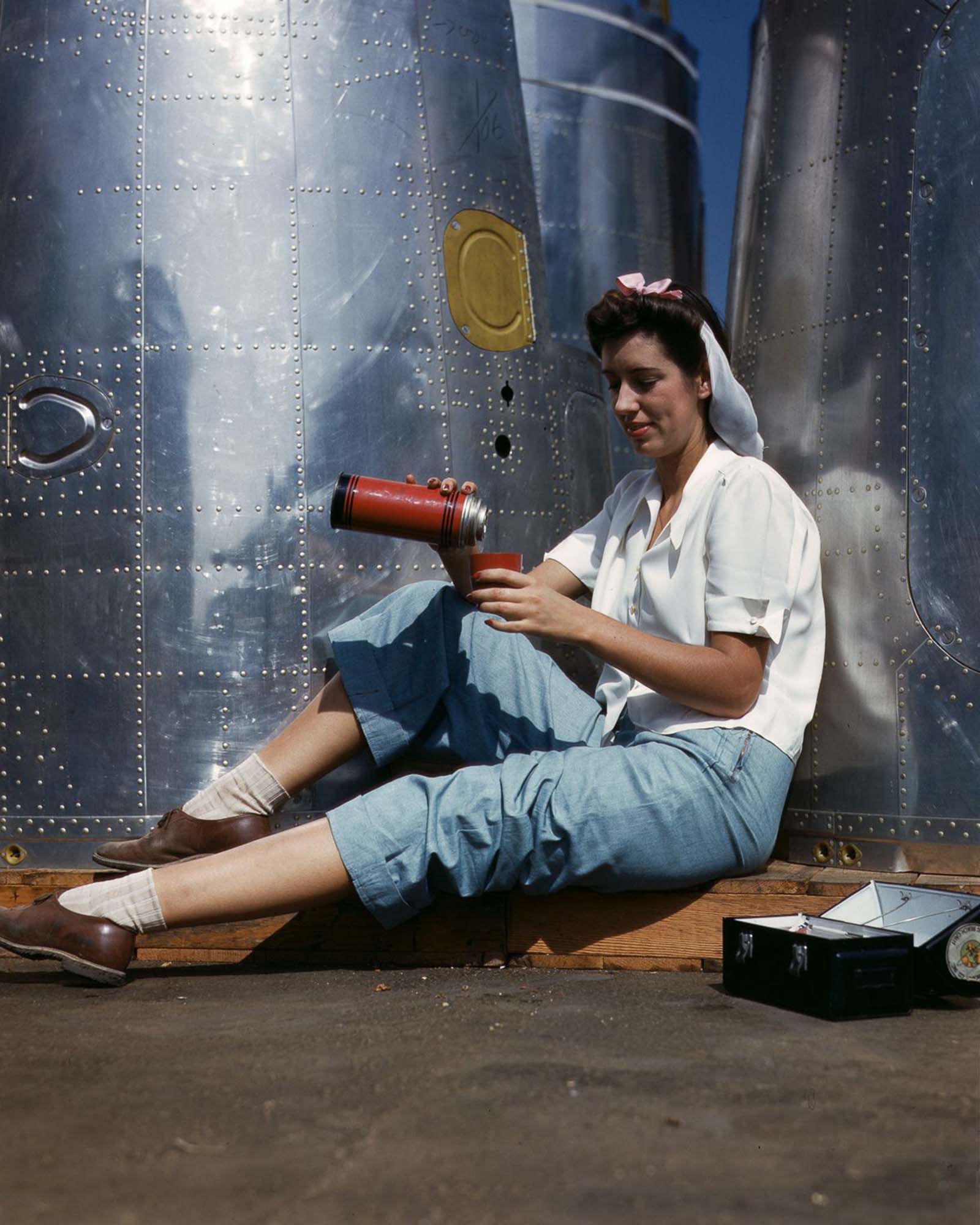 #21 A Douglas Aircraft Company employee on her lunch break at the plant in Long Beach, California, 1942.