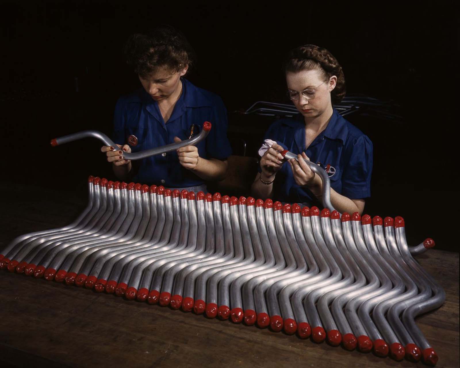 #30 Workers cap and inspect tubing for the A-31 “Vengeance” dive bomber at the Vultee plant in Nashville, Tennessee, 1943.