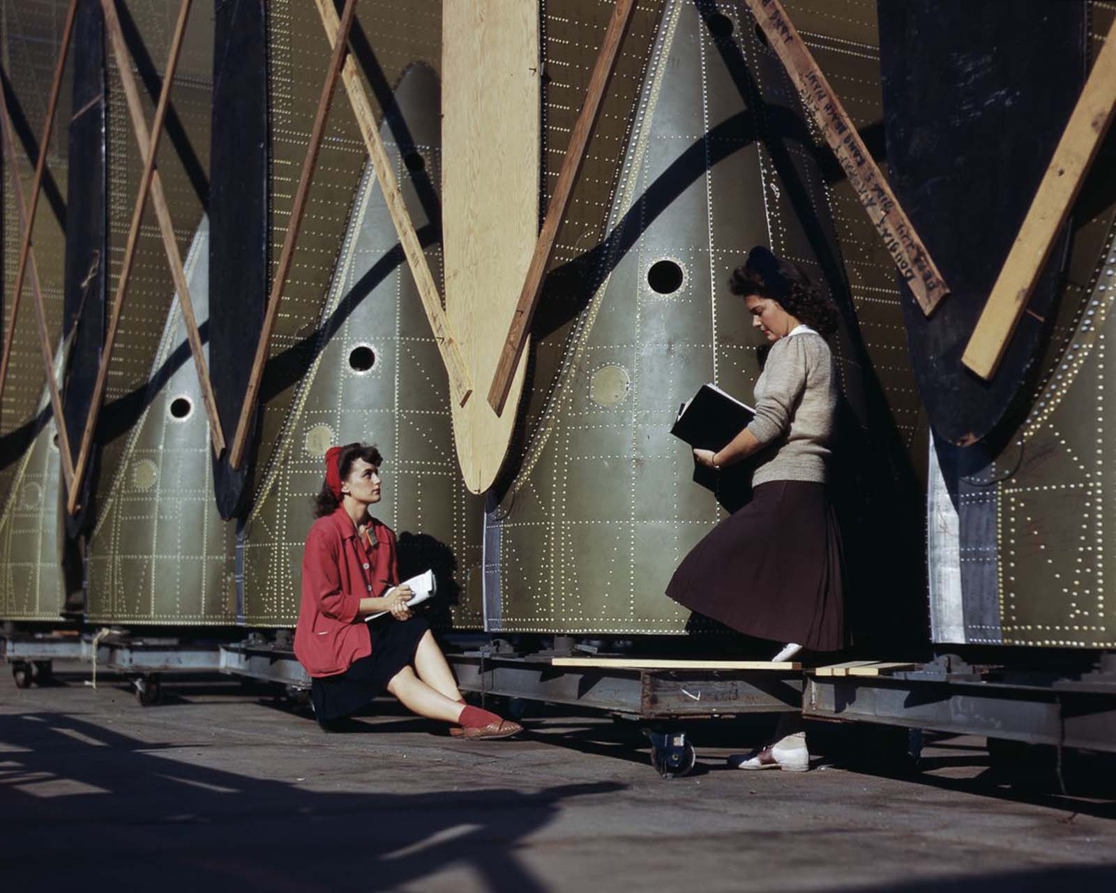 #2 Inspectors examine wing parts of C-47 transport planes at the Douglas Aircraft Company plant in Long Beach, California, 1942.