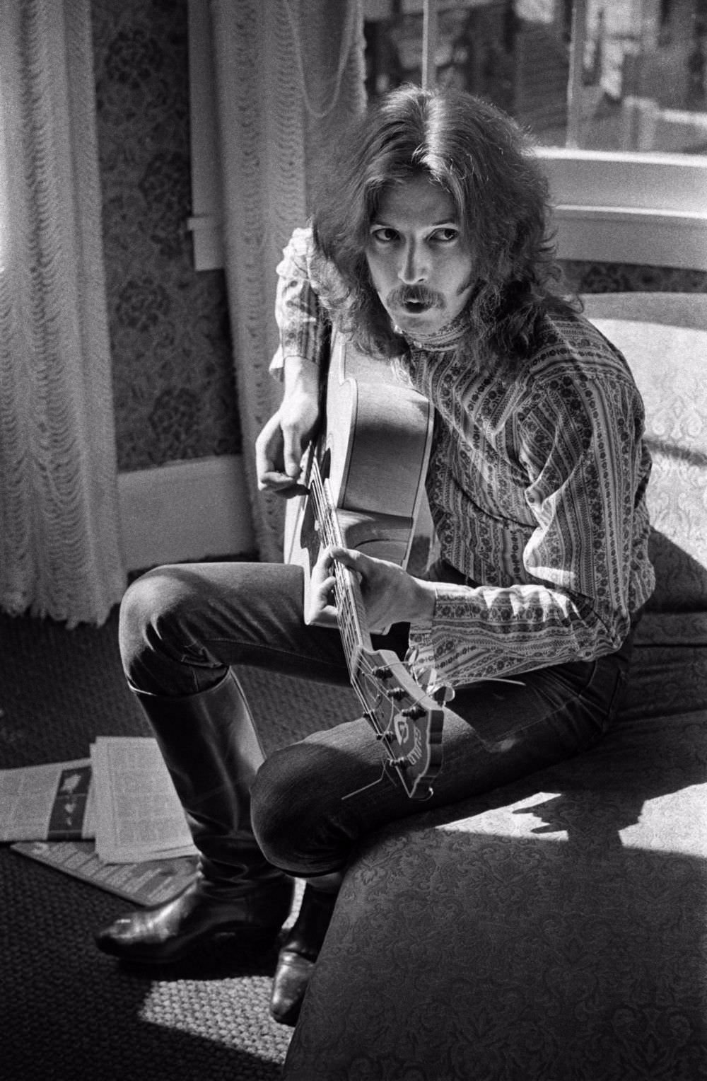 #12 Eric Clapton playing guitar in Jim Marshall’s apartment on Union Street, August 1967.