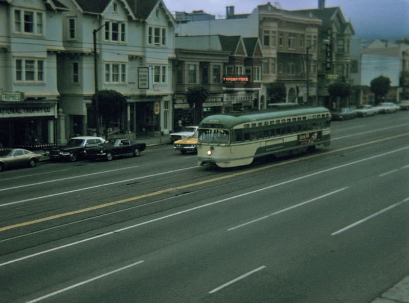 #10 PCC heading downtown on Market Street between Noe Street/16th Street and Sanchez Street/15th Street on a foggy early evening, 1970