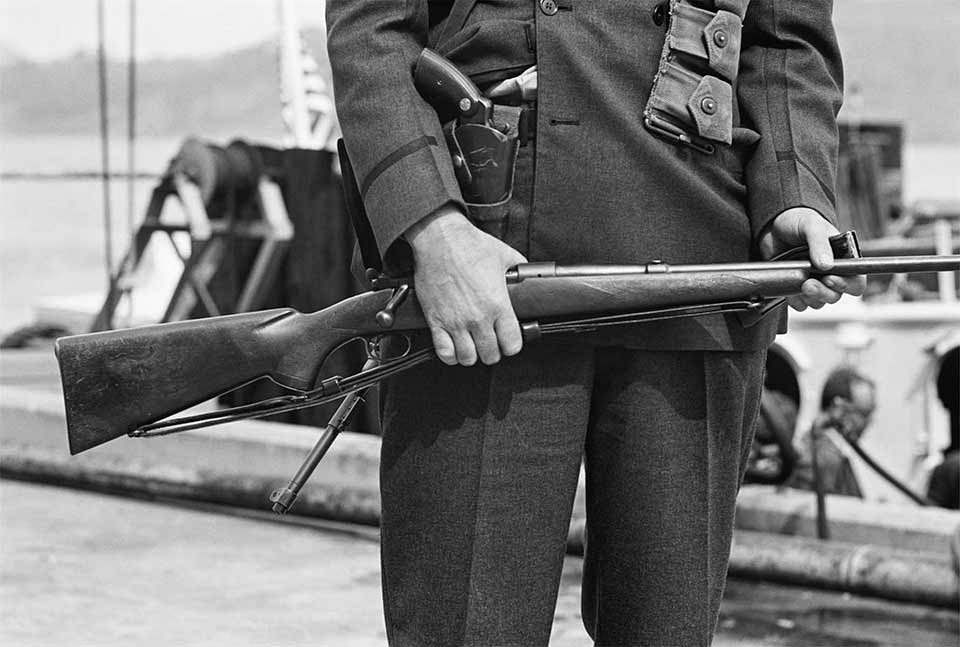 #17 Officer Gordon Gronzo – Officer Gordon Gronzo holding .30-06 rifle and wearing .38 police special revolver.